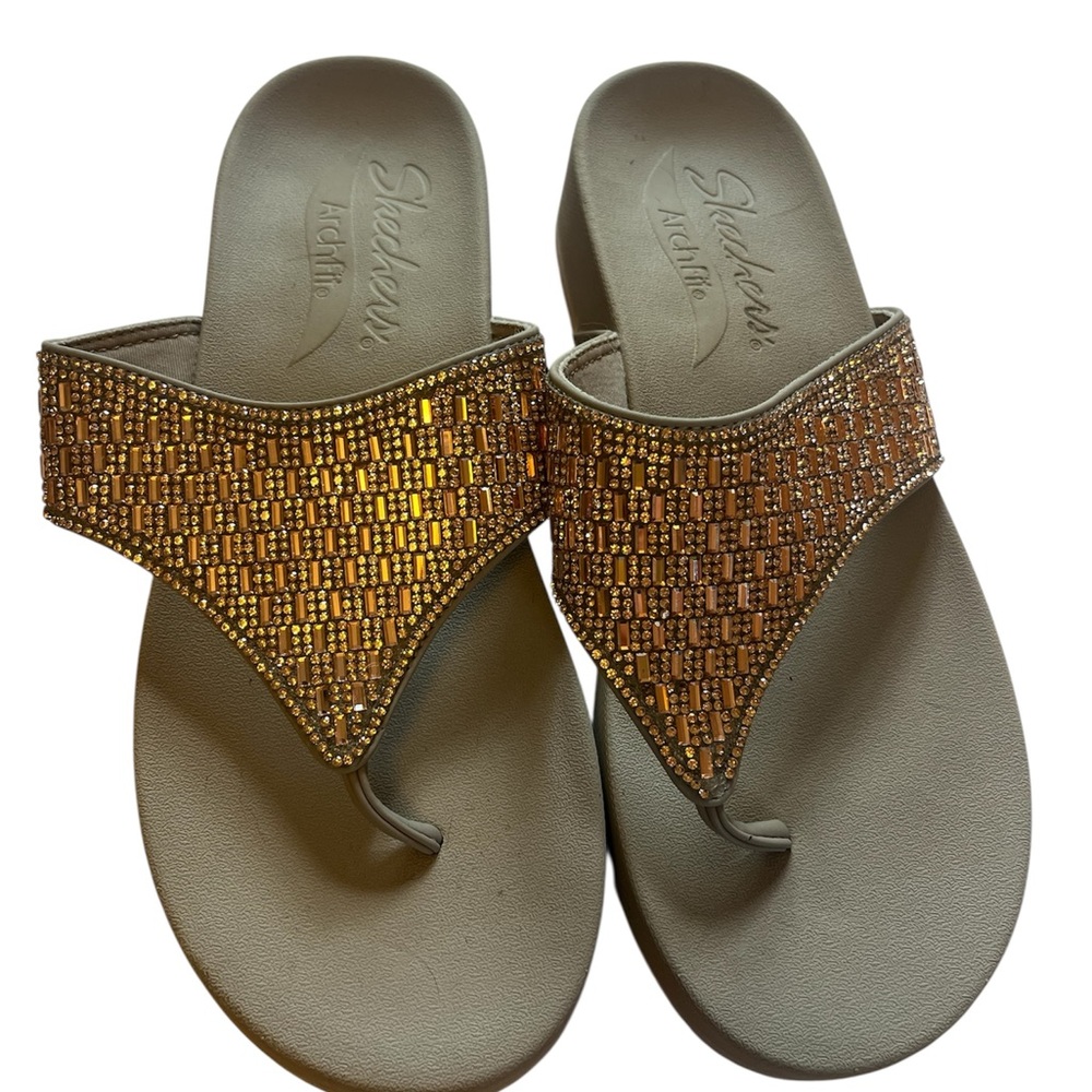 Woman’s Skechers Arch Fit Sparkle Slip on Sandals in taupe/copper size 11